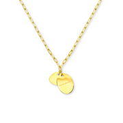 A gold necklace engraved with the word “Mama”
