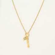 A gold necklace with the word “Mama” on it