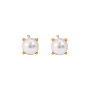 Simple pearl stud earrings with a salty, ocean-inspired style