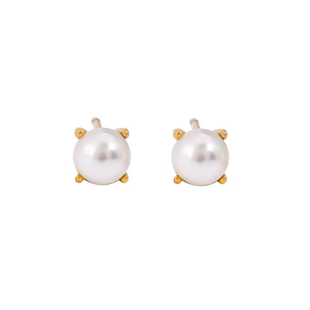 Simple pearl stud earrings with a salty, ocean-inspired style
