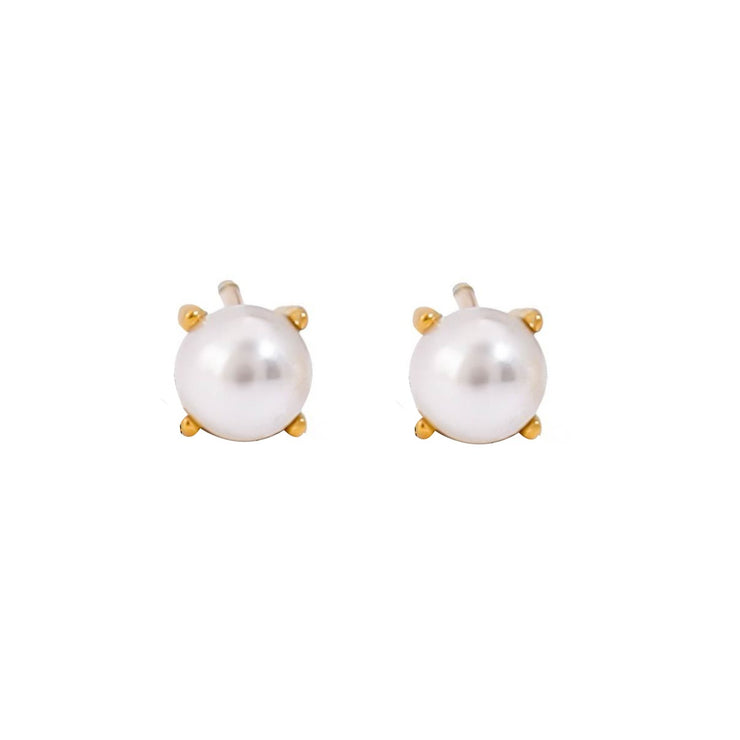 Simple pearl stud earrings with a salty, ocean-inspired style