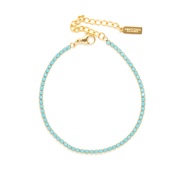 Blue tennis bracelet with adjustable gold detail