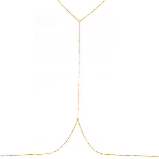 A delicate jewelry chain designed to be worn across the body