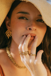 A dainty ring featuring coral-inspired design elements