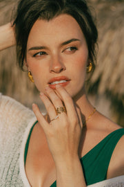 A dainty ring featuring coral-inspired design elements