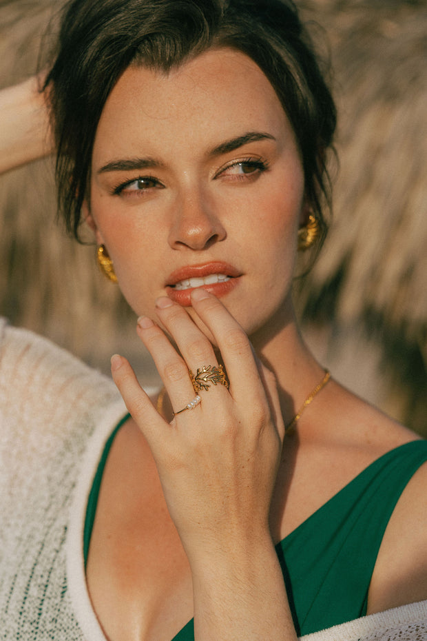 A dainty ring featuring coral-inspired design elements