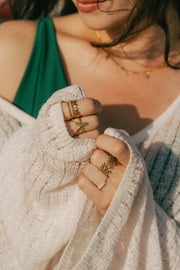A dainty ring featuring coral-inspired design elements