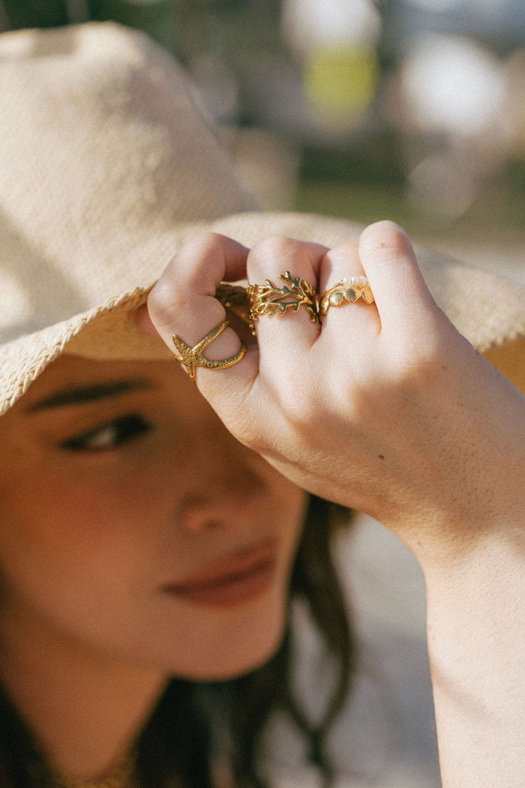 A dainty ring featuring coral-inspired design elements