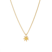 gold necklace with sun pendant