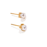 Simple pearl stud earrings with a salty, ocean-inspired style