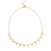 A choker necklace featuring shark tooth charms