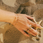 A bracelet featuring shooting star charm designs