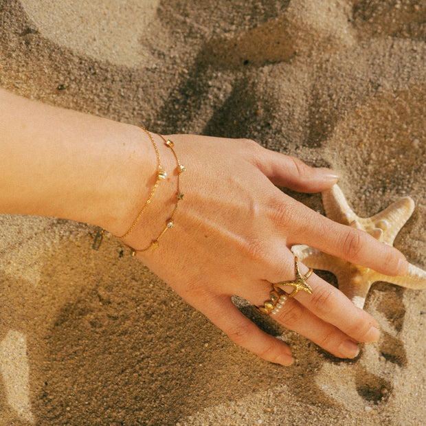 A bracelet featuring shooting star charm designs