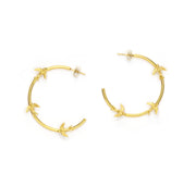 Gold hoops with songbird design