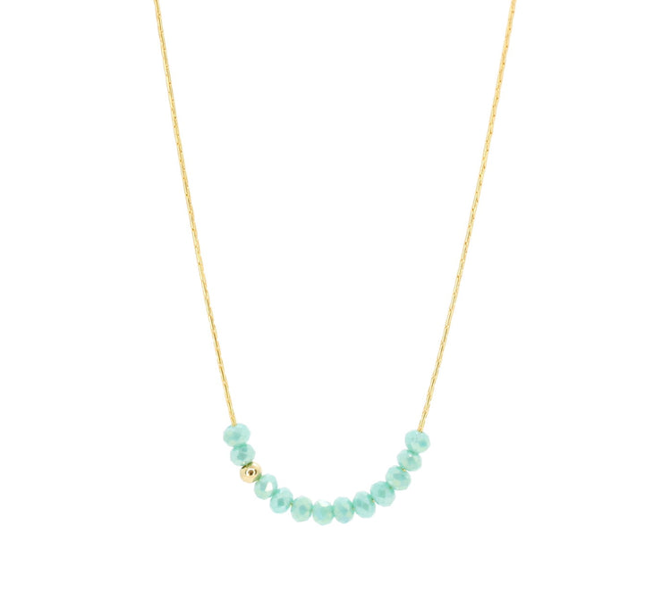 Dainty gold necklace chain with small turquoise beads. Beaded necklace