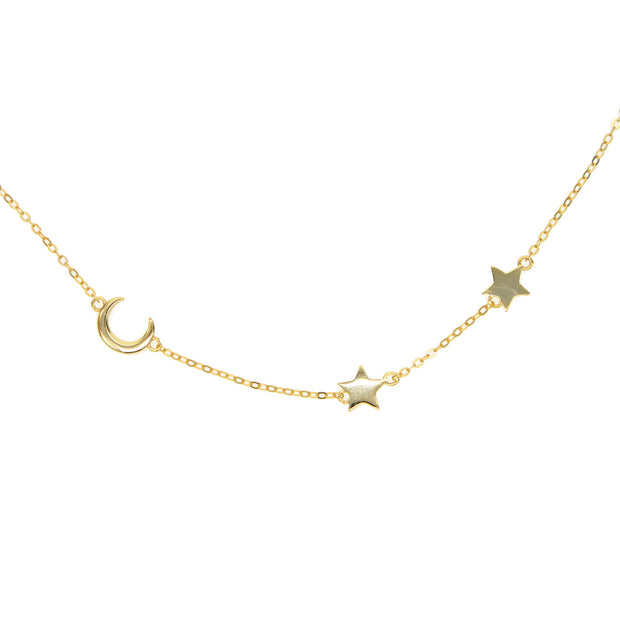 Gold necklace chain with small crescent moon charm and two star charms.